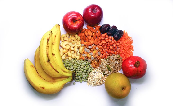 Dried fruits and nuts & fresh fruits on blank background.