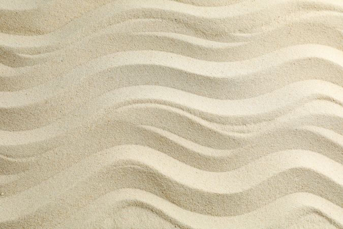 Seamless sand on a whole background, space for text. Summer vacation backdrop