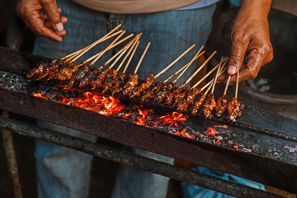 Man barbecuing chicken