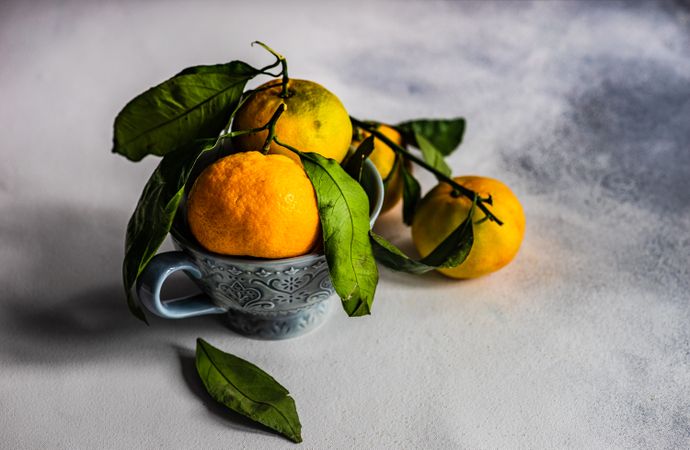 Organic tangerines in cup