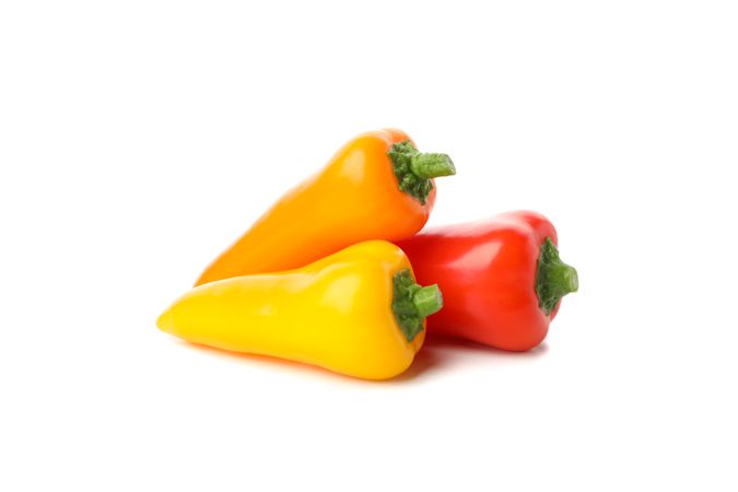 Fresh tasty peppers isolated on blank background