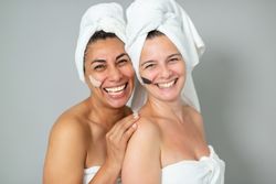 Happy women with strokes of masks