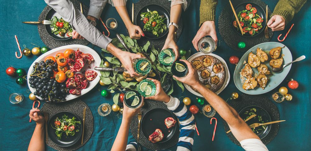 Christmas or New Year party dinner at festive table, top view