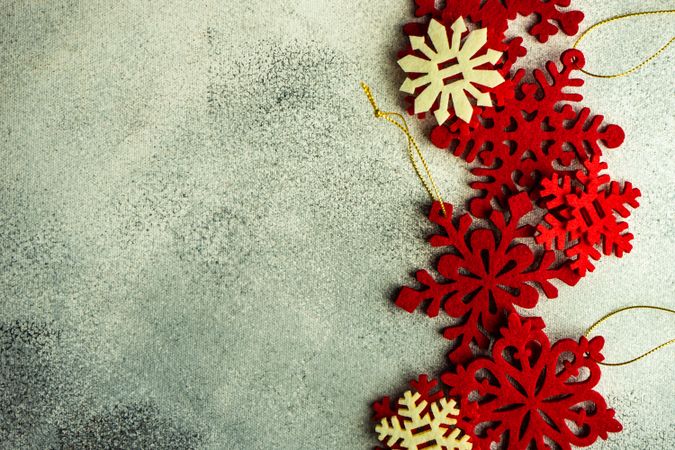 Christmas card concept of snowflake ornaments on concrete counter