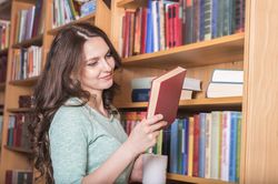 Smiling woman with a book in hand