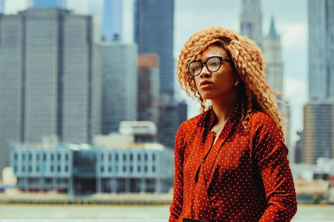 Close up of professional Black female with Manhattan in the background