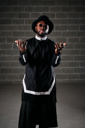 Man wearing Black outfit looking at camera