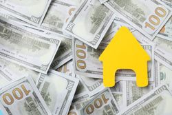 American cash money and yellow house, space for text