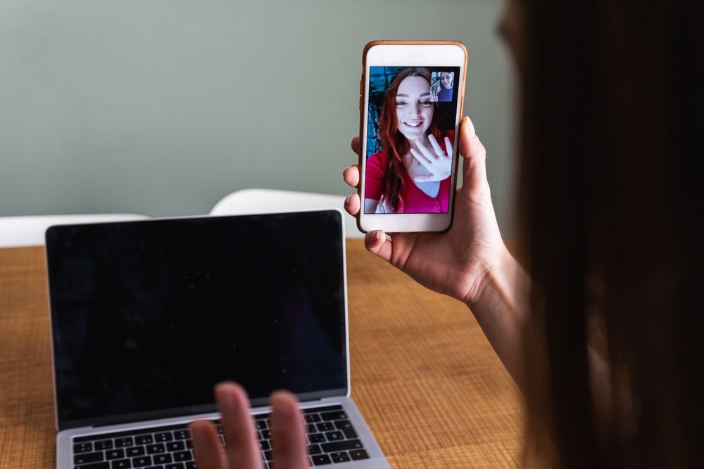 Crop woman having video call via smartphone