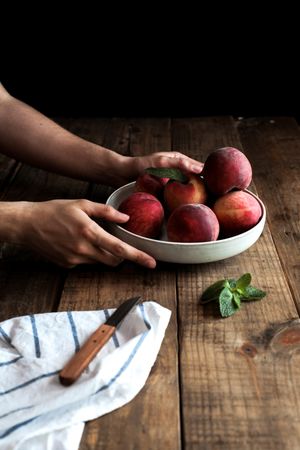 Tasty ripe peaches in plate