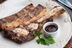 Meat dish served with sauce on plate