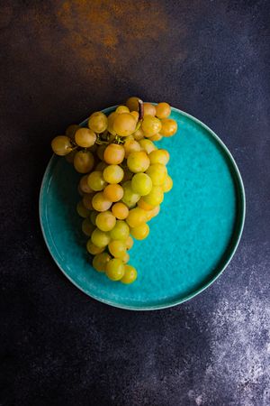 Plate of grapes on teal plate