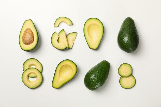 Flat lay with avocado on plain background, top view