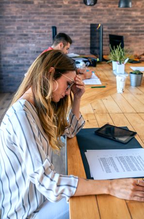 Businesswoman looking document in the office