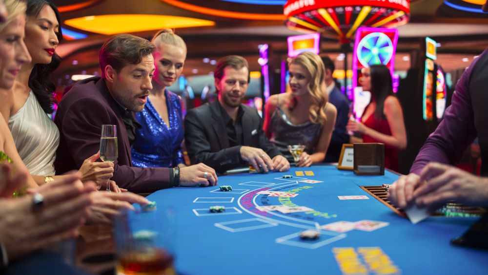 Group of Casino Goers Enjoying Time in a Modern Casino, Friends Placing Blackjack Bets