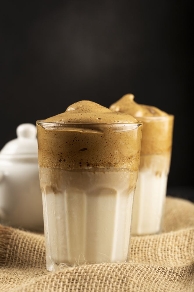 Iced Dalgona Coffee, glass with milk and coffee cream.