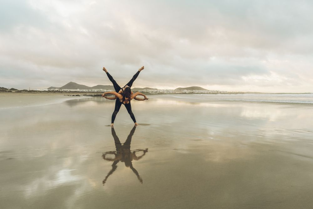 Women exercising near sea