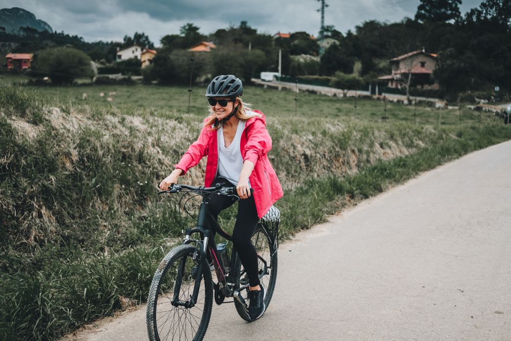 Smiling female riding bicycle