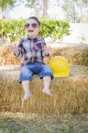 Boy Laughing with Sunglasses and Hard Hat