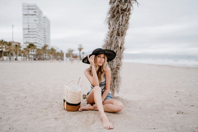 Young female relaxing on beach