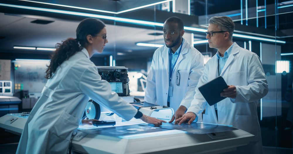Multiethnic Male and Female Scientists Discussing an Automated AI Robotic Delivery Machine in a Laboratory