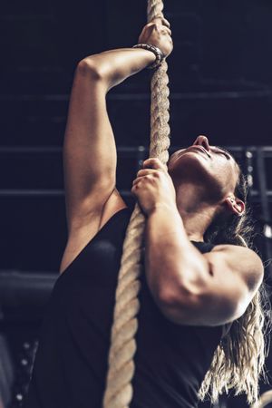 Fit female exercising in health club