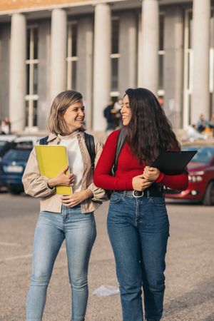 Two student talking. Leaving class