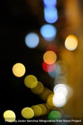 Blurry night lights along city street, vertical 0Kd1M5