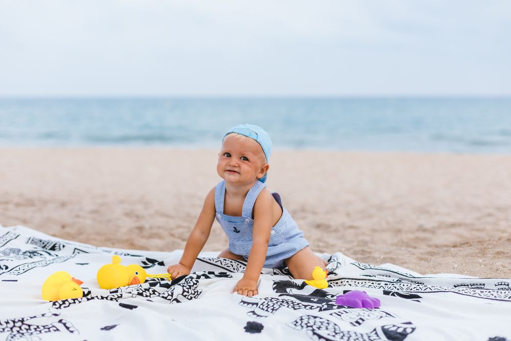 Baby boy playing with rubber ducks