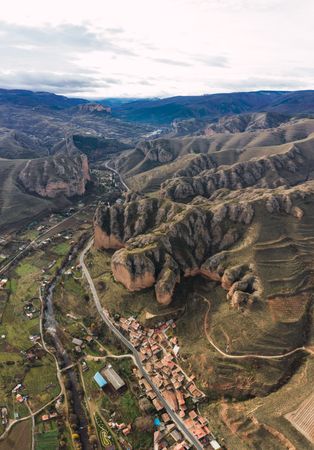 Majestic mountain range and distant rural town