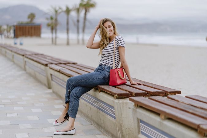 Young woman sitting on bench