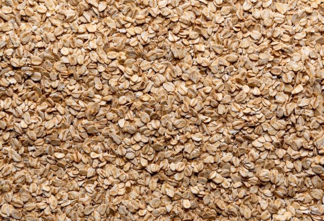 Oat cereals pile above view, full frame background