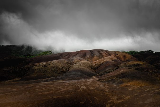 Colorful hill in Mauritius under clouds