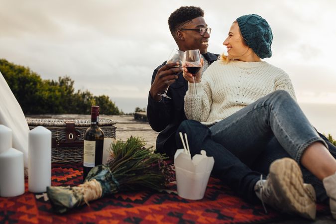 Couple having wine on a romantic date outdoors