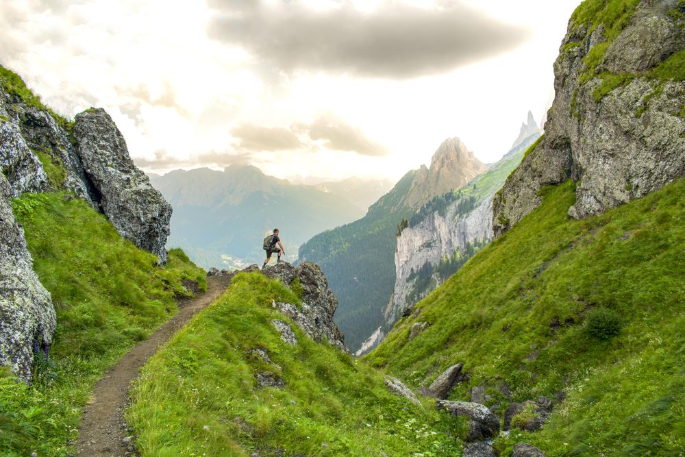 Man standing looking at the mountains