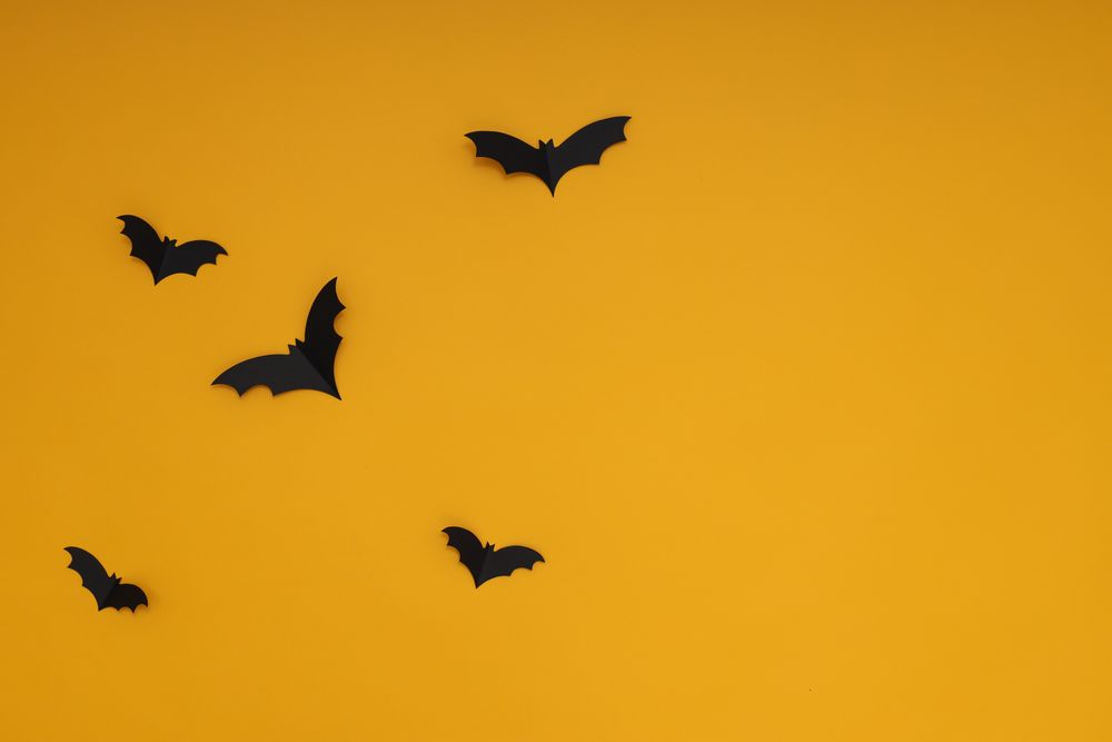 Yellow background with bats, in Halloween style