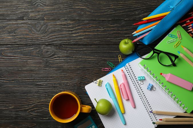School supplies on wooden background, space for text
