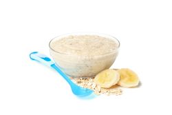 Bowl with healthy baby food isolated on plain background