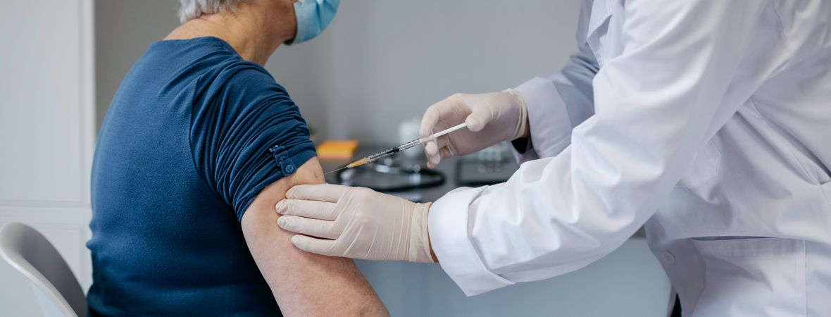 Mature woman being vaccinated against coronavirus