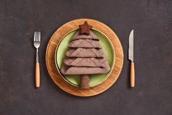 Holiday table setting with napkin in the shape of a tree