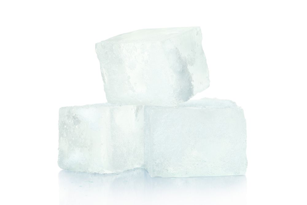 Ice cubes on plain background