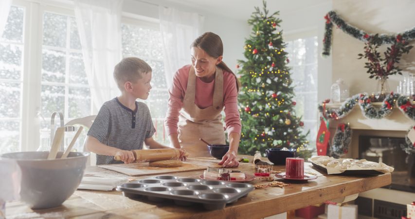 Portrait of Mother and Son Preparing for Baking Gingerbread on Christmas.