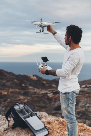 Man holding drone and remote