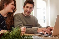 Couple shopping online at home for Christmas 5lVvrY