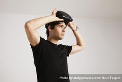 Man removing VR headset 0WKLp0