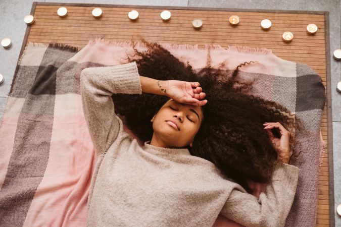 Black woman lying on floor