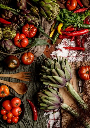 Assorted vegetables and napkins on table