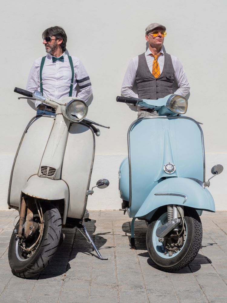 Trendy friends with vintage scooters