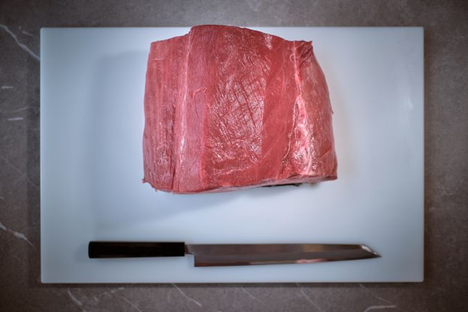 Fresh raw tuna on kitchen table