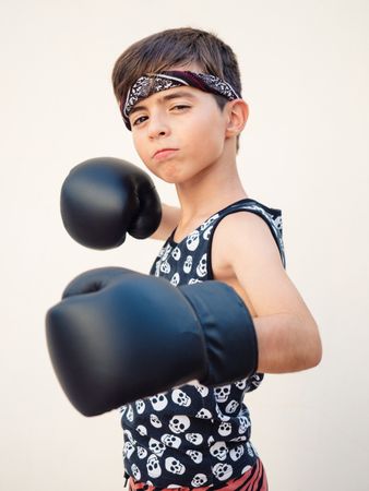 Sporty boy with boxing gloves